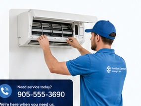 HVAC technician servicing a wall-mounted unit